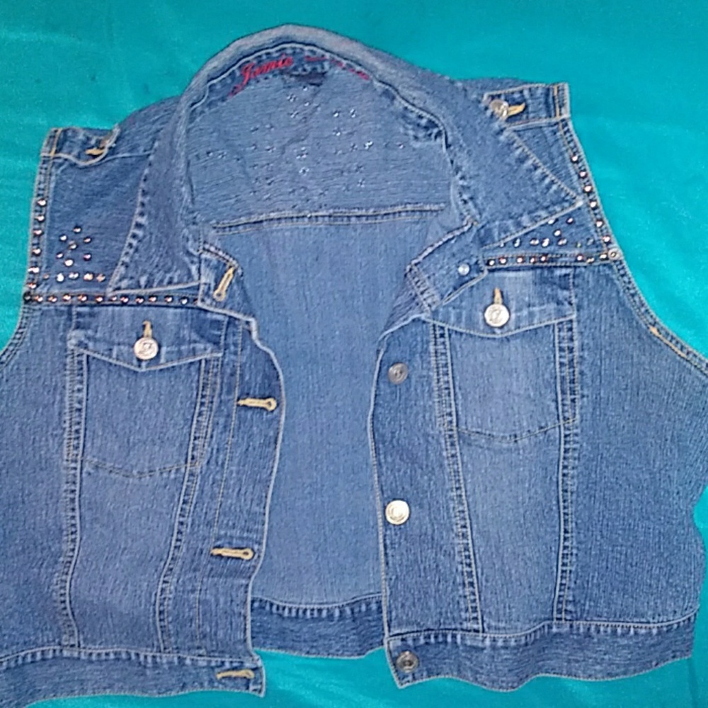 Sleeveless blue jean denim jacket with studs